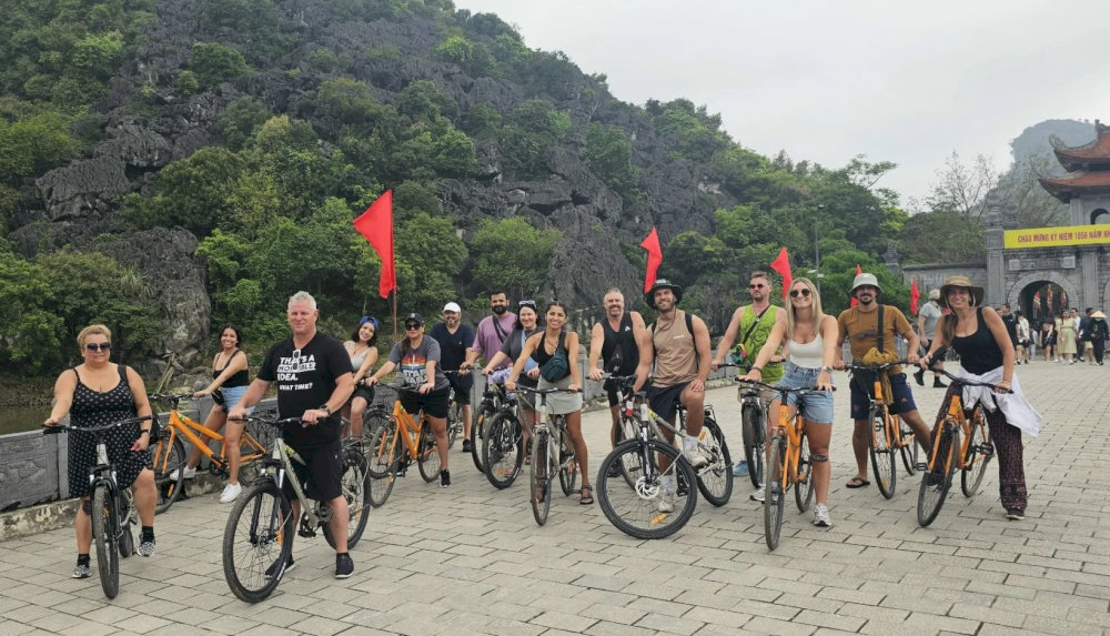 Cycling in groups to various tourist attractions within the Trang An Scenic Landscape Complex is also a delightful experience 